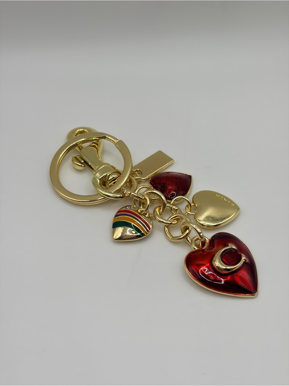 Trendy Gold-tone Heart Charm Keychain with Red Enamel Hearts